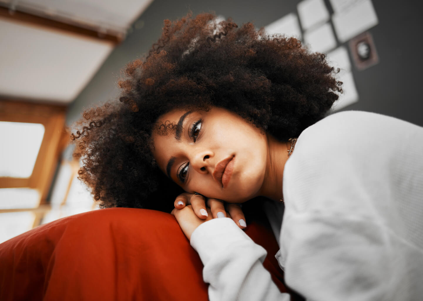 Person lying awake on a sofa