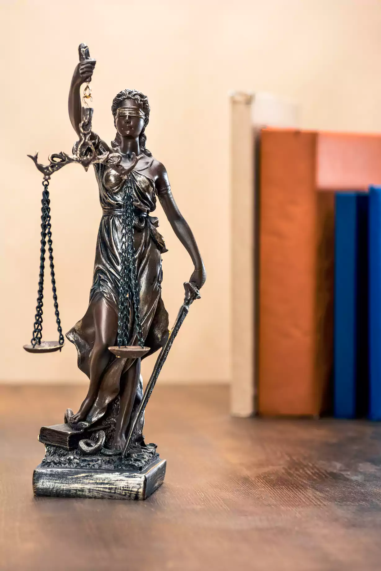 a statue of a woman holding a scale and a sword