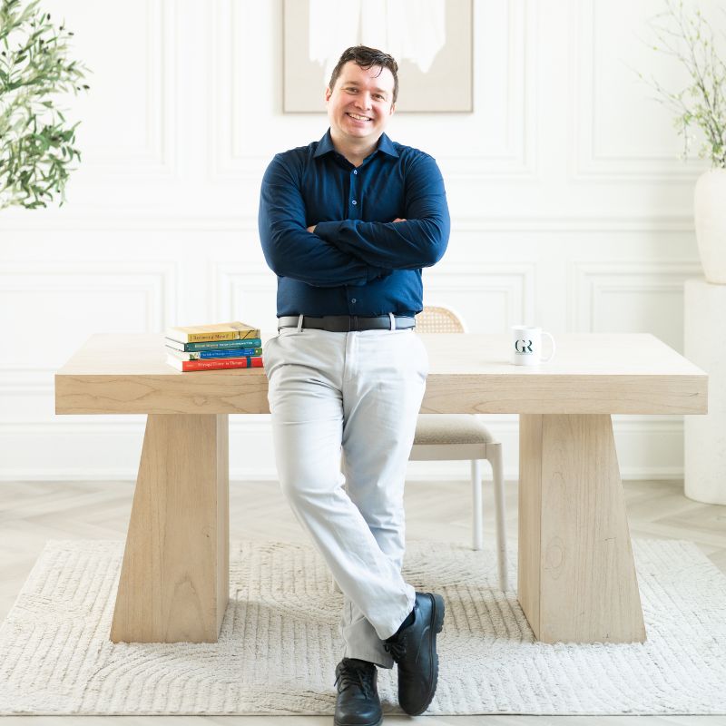 Adam Adivi standing in the Get Reconnected office