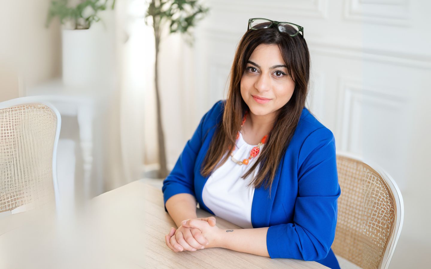 Sep Nikmanesh, Counsellor, seated in the Get Reconnected office