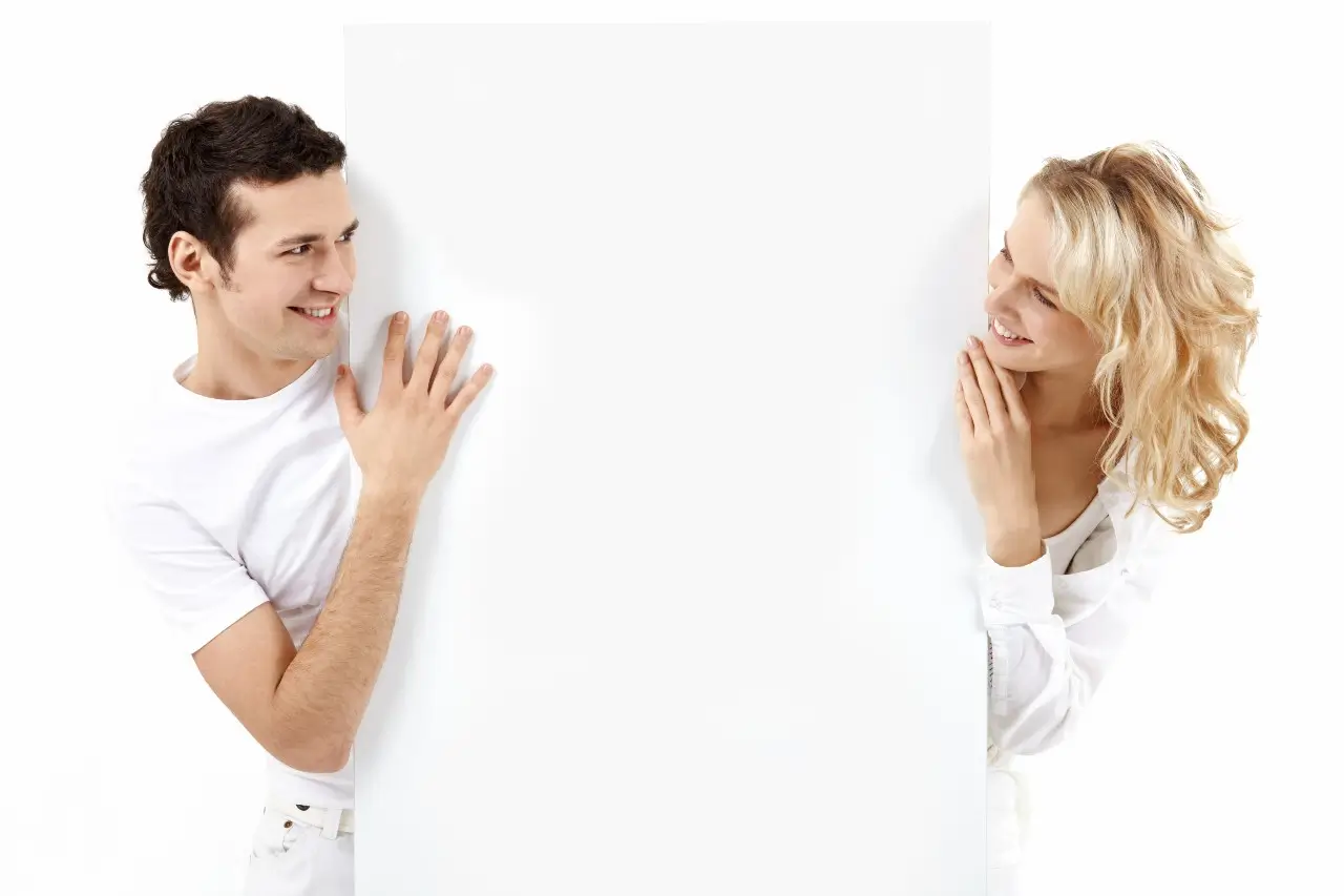 aguy and the girl exchange glances through an empty banner
