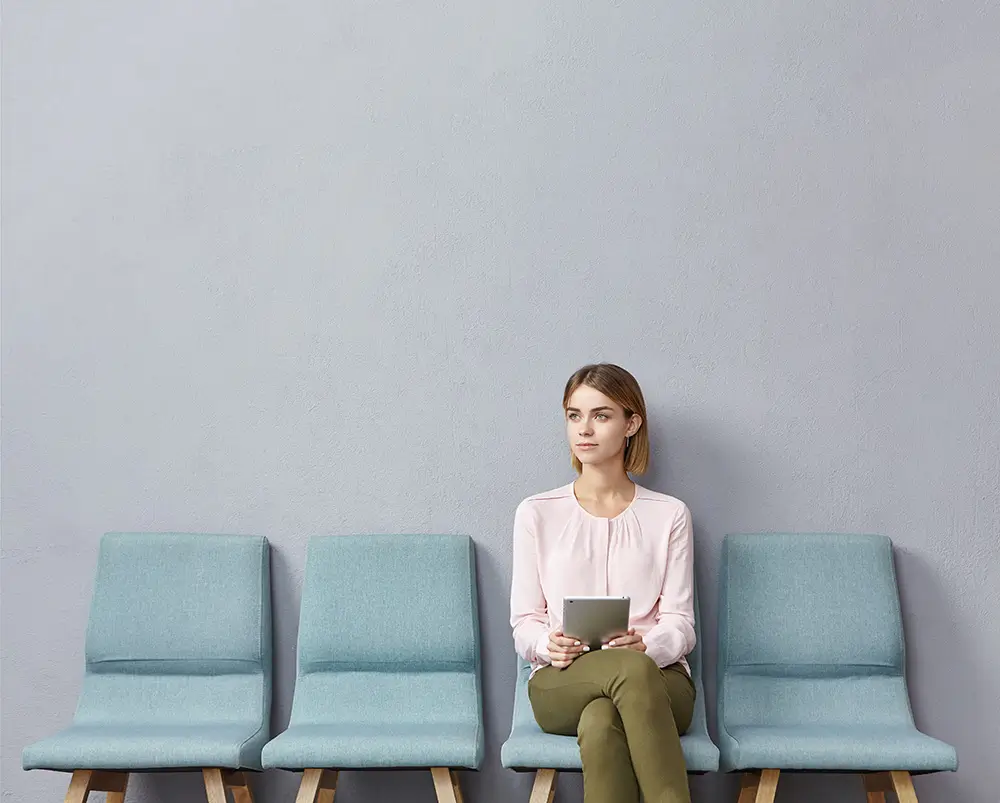 woman waiting in line at a clinic