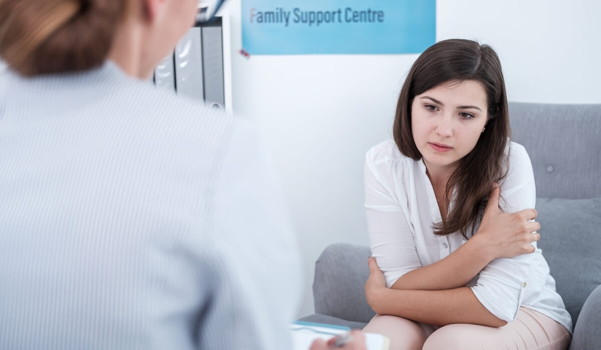 A woman meets with a therapist expressing worry often linked to infertility depression.