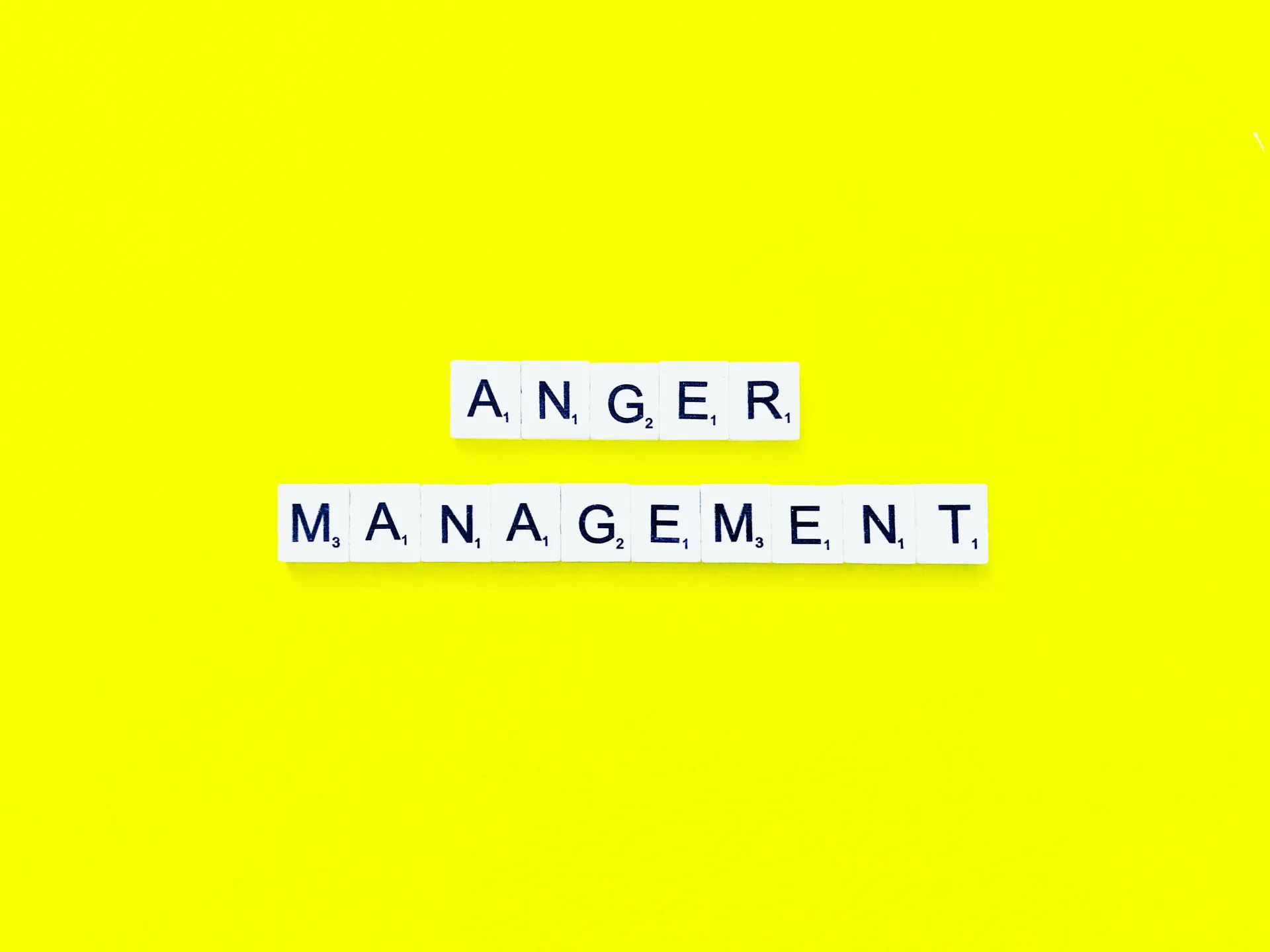 Letter tiles spelling anger management