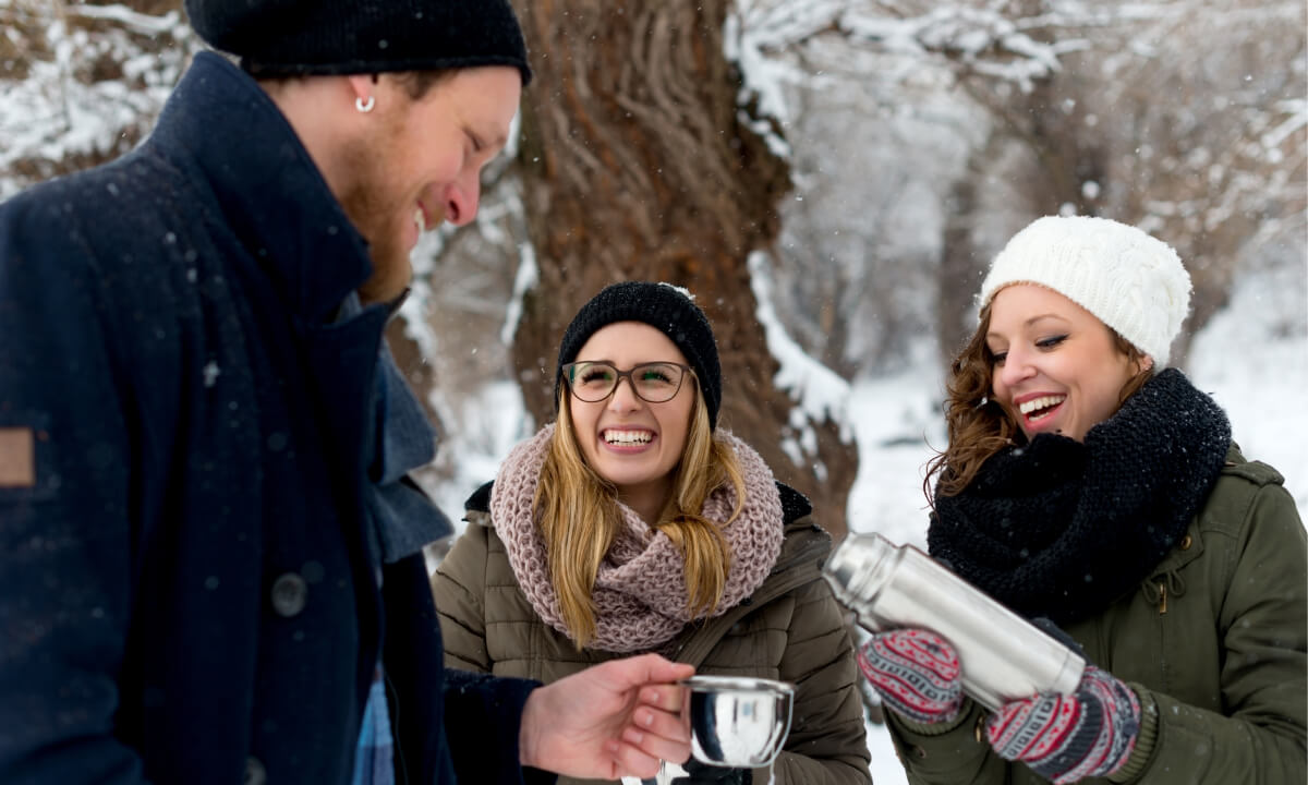 friends enjoying hot tea in nature during winter 2024 11 27 17 59 54 utc