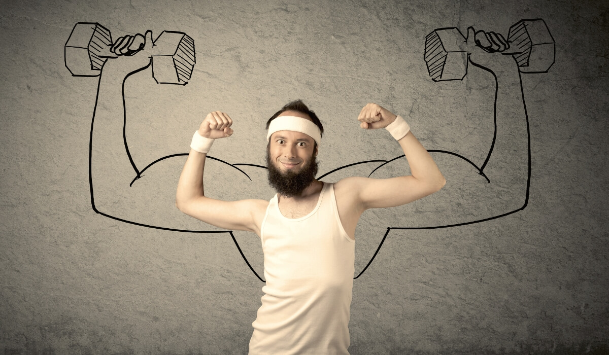 A man stands before drawn muscular arms, highlighting the contrast between strength and emotion. Image used by Get Reconnected Psychotherapy and Counselling Services. Contact info@getreconnected.ca.